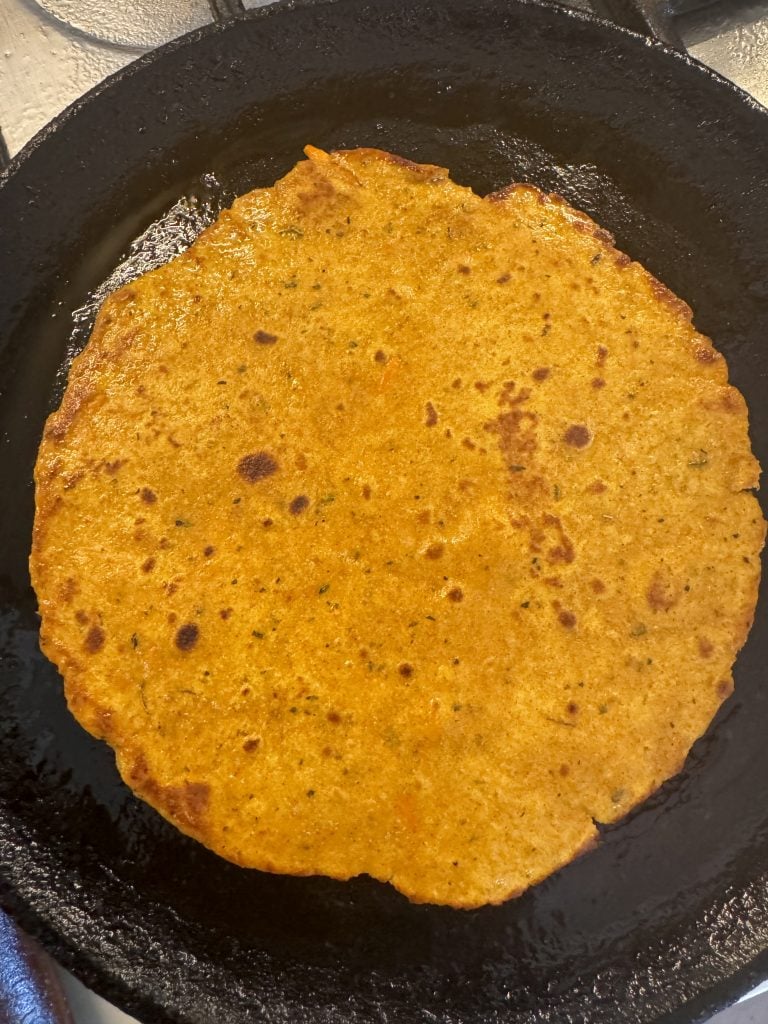 Golden brown rajgira paratha with brown spots, indicating it's cooked to perfection on both sides.